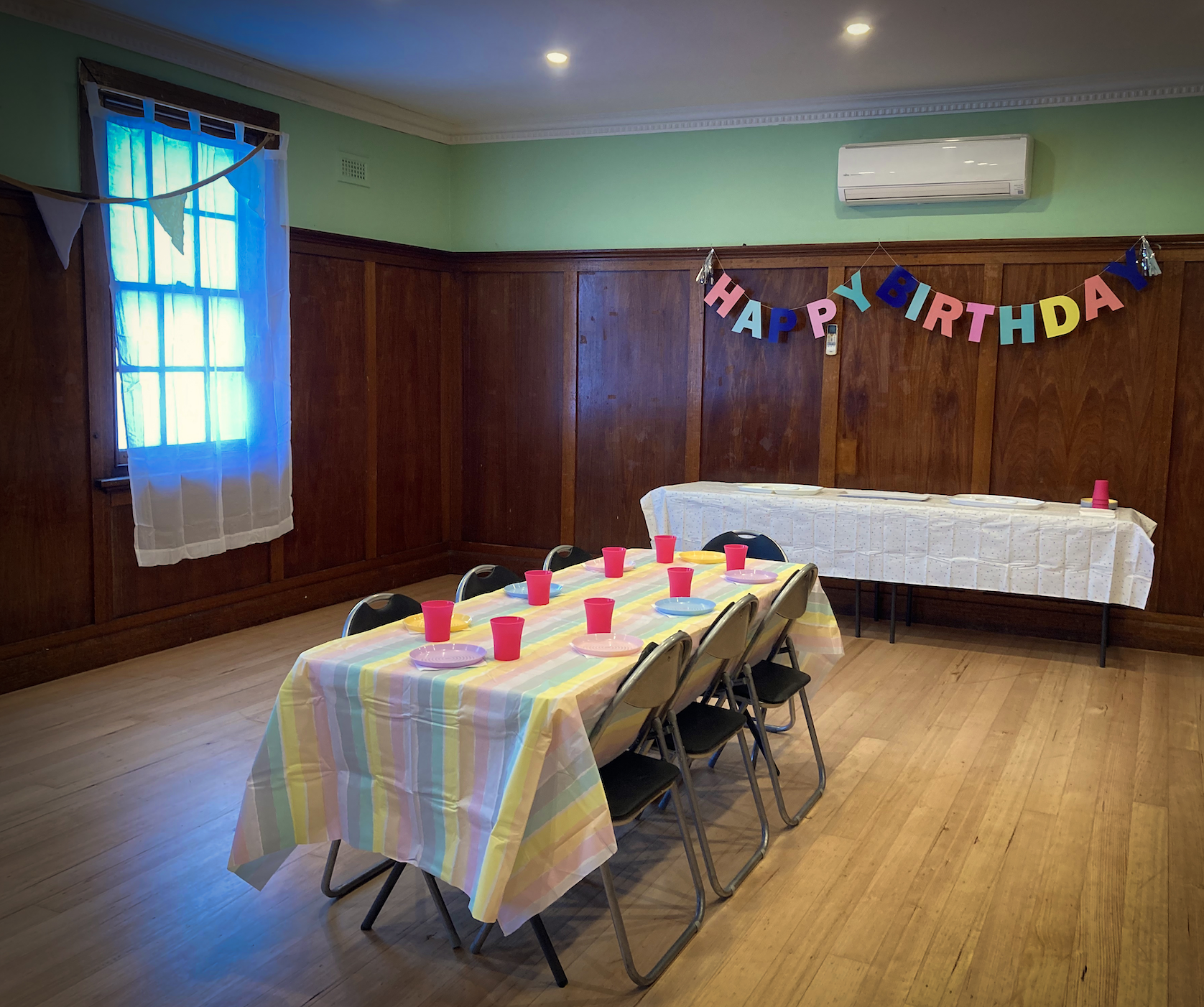 Women's Circus birthday party set up in the community room